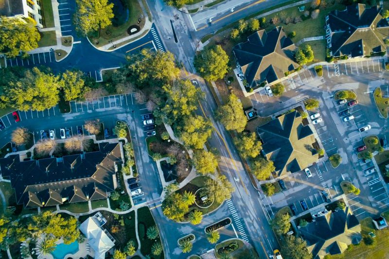 Scenic aerial view of Lake Mary, FL with residential streets and abundant lush greenery.